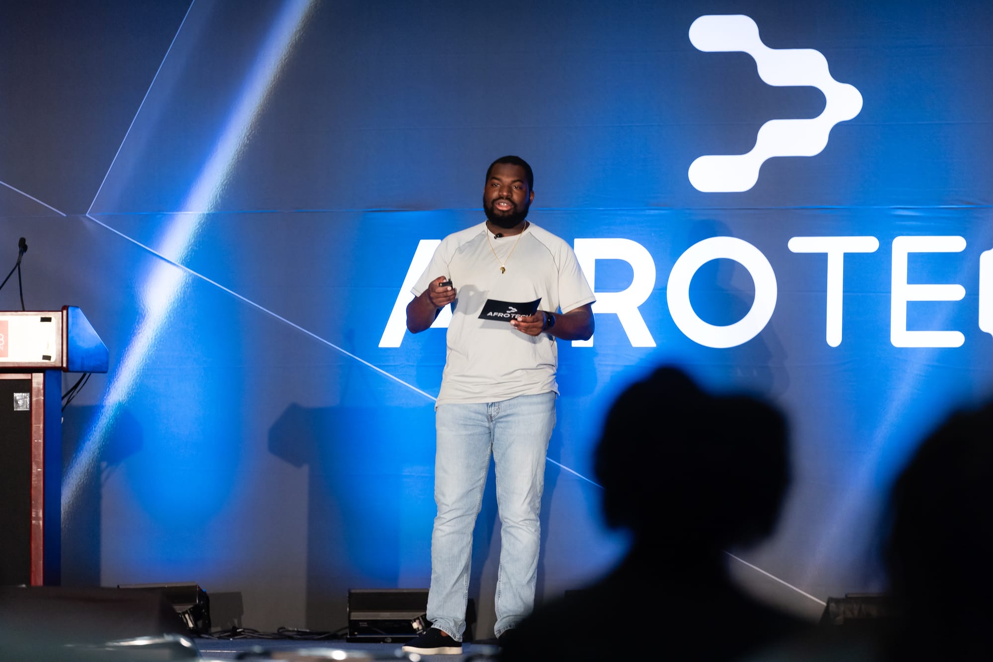 Alex on stage at AfroTech 2024